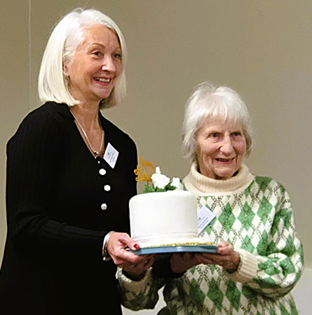 Our President presents a cake to a member for her 90th birthday