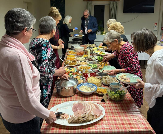 Ladies serving food for the new year party