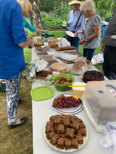 A table loaded with cakes that some members had baked