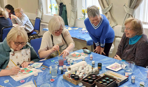 Tutor Ann with three ladies at the silk painting table